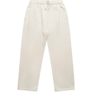 Cuffless track pants in a light beige colour, featuring an elastic waistband and side pockets. Includes a logo.