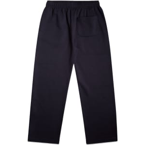 Cuffless track pants in dark navy with an elastic waistband and a single back pocket. Features a logo.