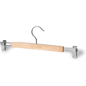 A wooden clip hanger in natural colour with metal clips and a silver hook. It has a logo on the wooden part.
