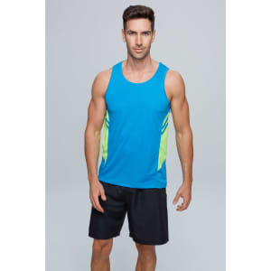 A man models a blue singlet with lime green side panels, paired with black shorts. The singlet has a logo.