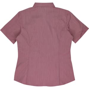 A short-sleeve button-up shirt in a light pink hue, featuring a back yoke and shaping seams. It has a logo.