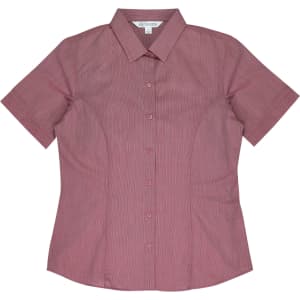 A short-sleeve button-up shirt in a burgundy hue with a fitted design and a collar. Features a logo.