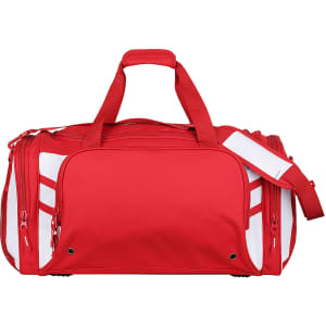A red duffle bag with contrasting white accents and a logo. It features two handles and a detachable shoulder strap.