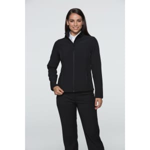 A woman wearing a black soft shell jacket, featuring a zippered front and two side pockets. The jacket has a logo.