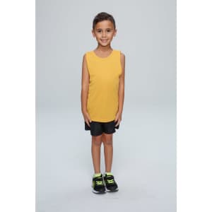 A child stands smiling, wearing a yellow singlet and black shorts, with black and green shoes. The image features a branding logo.
