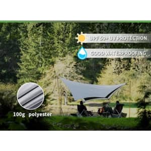 A grey camping canopy with poles set up in a green outdoor area, featuring UV protection and water-proofing.