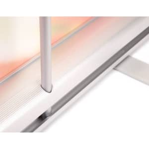 A close-up of the base mechanism of a lightweight pull-up banner, featuring silver and transparent components.