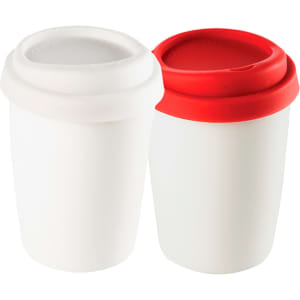 A ceramic mug set featuring a white mug and a red-lidded mug, both with lids and rounded designs.