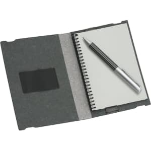 A6 Jotter in charcoal grey featuring a spiral-bound notebook and a silver pen, with an elastic strap on the cover.