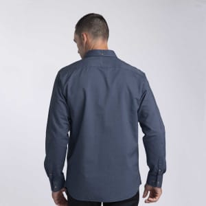 A back view of a men's button-up shirt in navy blue, featuring a collar and long sleeves. The shirt has a logo.