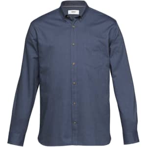 A navy button-up shirt with a pocket and a branded label on the collar. Features long sleeves and brown buttons.