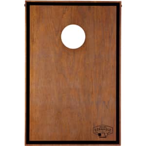 A wooden cornhole board featuring a round hole and a dark border, branded with a logo at the bottom.