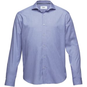 A button-up shirt in light blue with a classic collar and long sleeves, featuring a brand logo.
