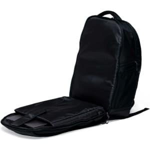 A black Grid-Lock Backpack with a zipped compartment open, featuring padded sections for laptops.