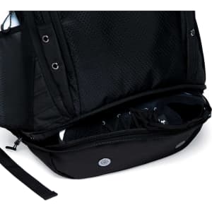 A black backpack with a mesh exterior and a zipped compartment for shoes at the bottom.