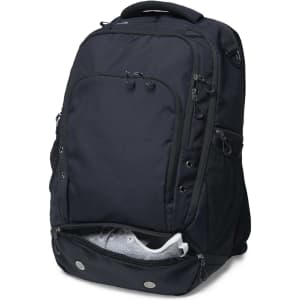A black Metro-Lock Backpack featuring multiple compartments and a zippered shoe pocket at the bottom.