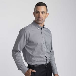 A men's button-up shirt in grey, featuring a button-down collar and a chest pocket, with a logo on the side.