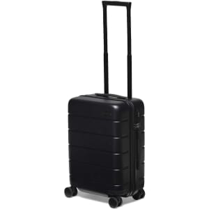 A black hardcase trolley with a telescopic handle and four wheels, featuring a logo on the front.