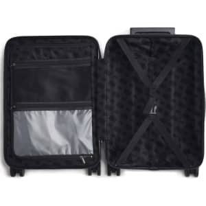 A black hardcase trolley suitcase with a patterned interior and zippered compartments, featuring adjustable straps.