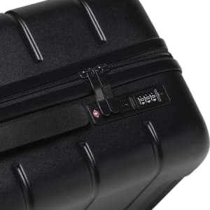 A black hardcase trolley with a zip closure and a combination lock mechanism. It features a textured surface.