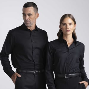 A black button-up shirt for men and women, featuring a sleek design and a subtle logo.