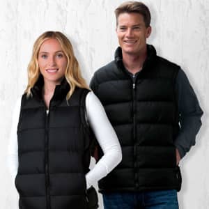 A black puffa vest is worn by a man and a woman, featuring a zip front and side pockets. The vest has a logo.