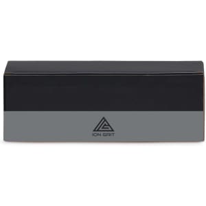 A black rectangular box with a grey band, featuring a logo on the front.