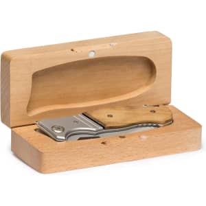 A pocket knife with a silver blade and wooden handle, presented in a wooden box.