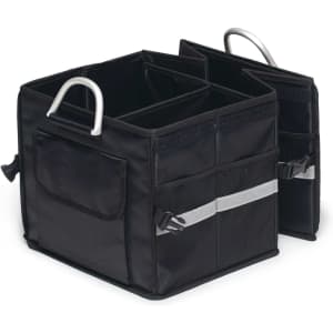 A black boot organiser with two compartments, featuring side pockets and metal handles for easy carrying.