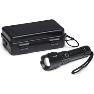 A black torch beside a black carrying case, featuring a textured grip and a wrist strap.