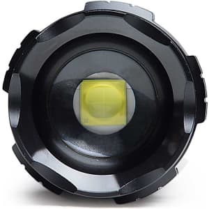 A black torch with a yellow light, featuring a textured grip and round head, and a logo displayed on the body.