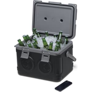 A sound box cooler in black containing bottles and ice, featuring speakers and a handle on the side.