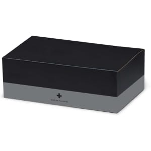 A black first aid kit box with a grey band, featuring a logo and containing essential medical supplies.