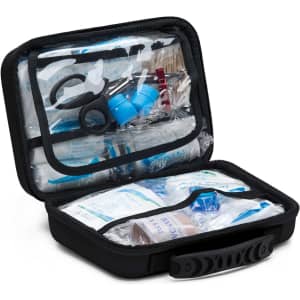 A black first aid kit opened to reveal various medical supplies, including scissors and blue containers.
