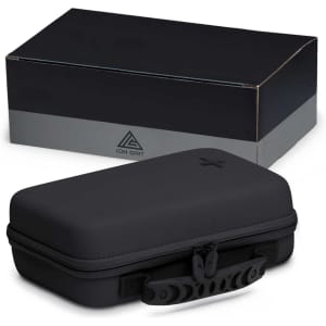 A black first aid kit with a sturdy case and zipper, placed beside a rectangular grey box featuring a logo.