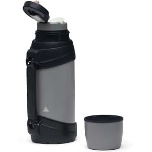 A drink bottle in grey with a black lid and handle, accompanied by a matching cup. It features a logo on the bottle.