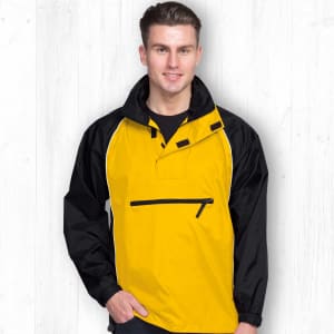 A man is wearing a yellow and black Nylon Jac Pac jacket with a half-zip and a logo on the front.
