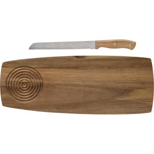 A wooden cheese board with a circular design and a serrated knife with a wooden handle.