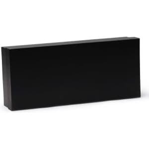 A black rectangular block made of solid material, featuring a smooth surface and sharp edges.