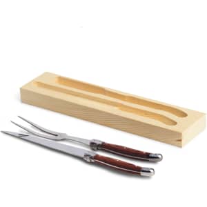 A Bordeaux carving set with two stainless steel utensils featuring wooden handles, presented in a wooden storage box.
