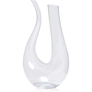 A clear glass Barolo wine decanter with a unique, curved design and two spouts.