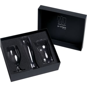 A black gift box contains three clear glass beer glasses in various shapes, nestled in black cushioning.