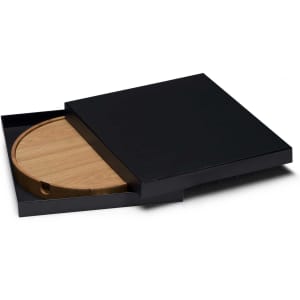 A round bamboo placemat with a black box for storage, featuring a sleek design and subtle branding.