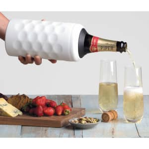 A drink bottle in white with a textured surface, holding a sparkling wine being poured into two flutes, beside strawberries and cheese.