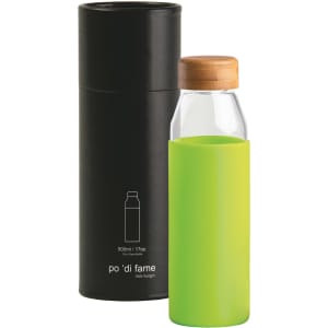 A drink bottle with a green silicone sleeve and a wooden lid, presented in a black cylindrical casing.