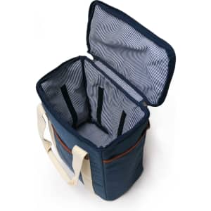 A wine cooler bag in navy blue with a striped interior and two compartments, featuring a cream-coloured strap and a logo.