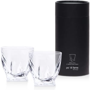 A set of two clear crystal whisky glasses in a black cylindrical box, featuring a sleek design.