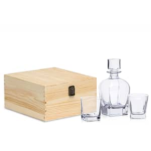 A whisky decanter set featuring a clear glass decanter, two matching glasses, and a wooden storage box.