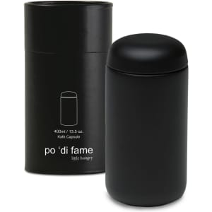 A black drink bottle in a matching black cylindrical container, featuring a logo on the side.