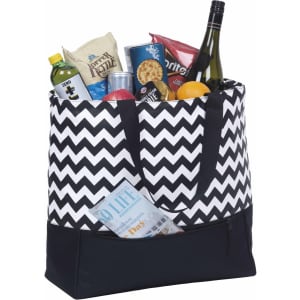 A chevron-patterned cooler tote in black and white, filled with snacks, drinks, and a bottle of wine.